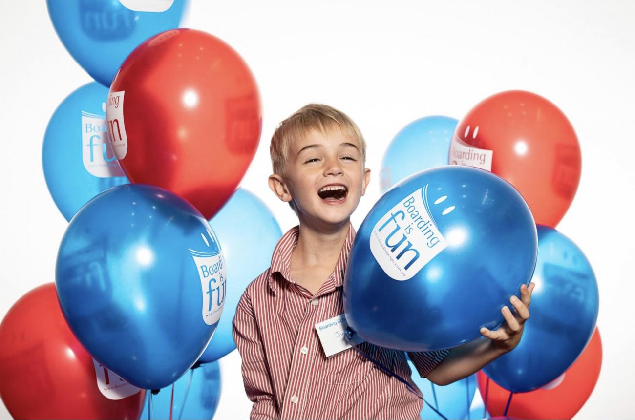 Child with Expo Balloons