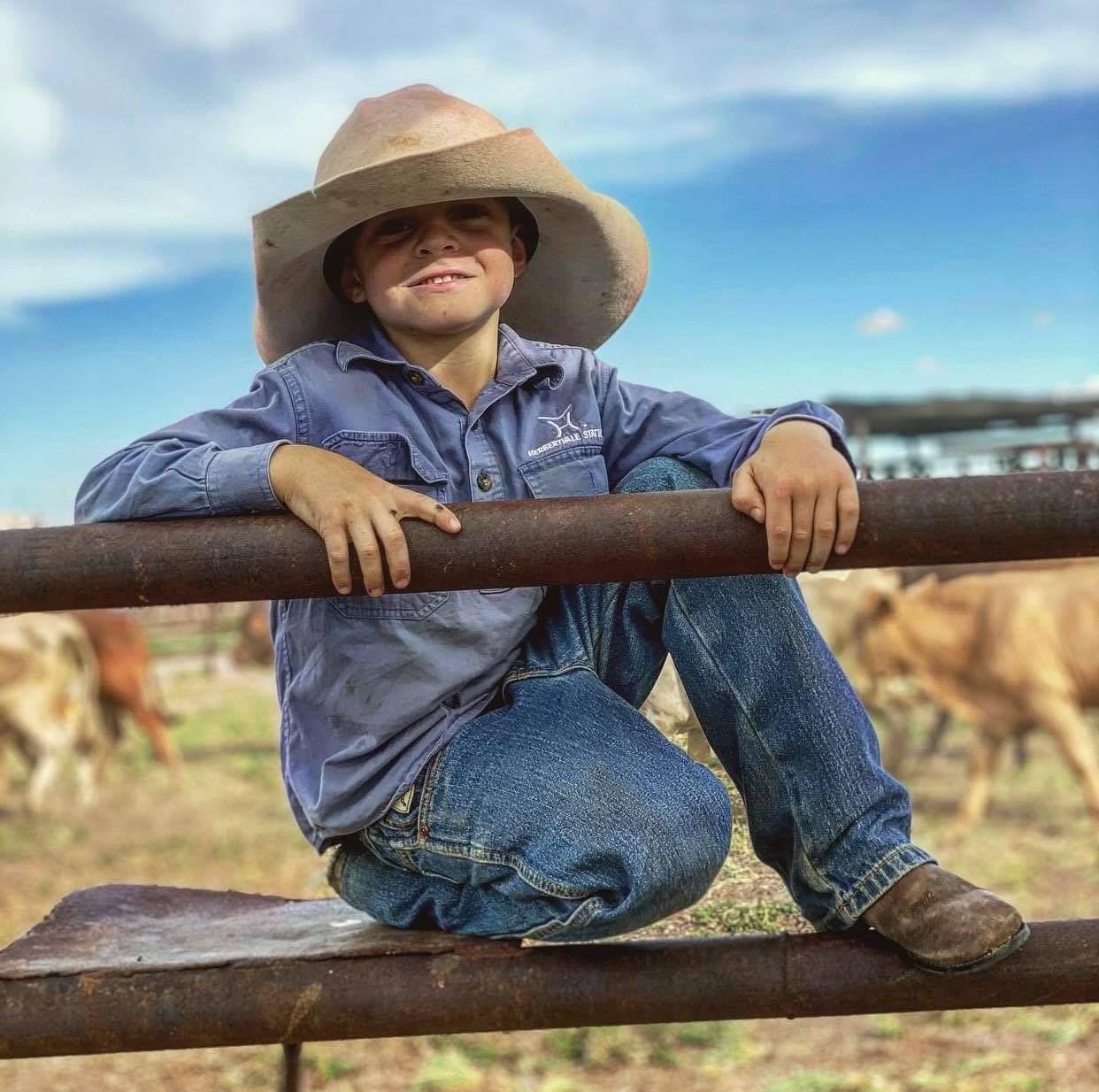 boy in cattle yards