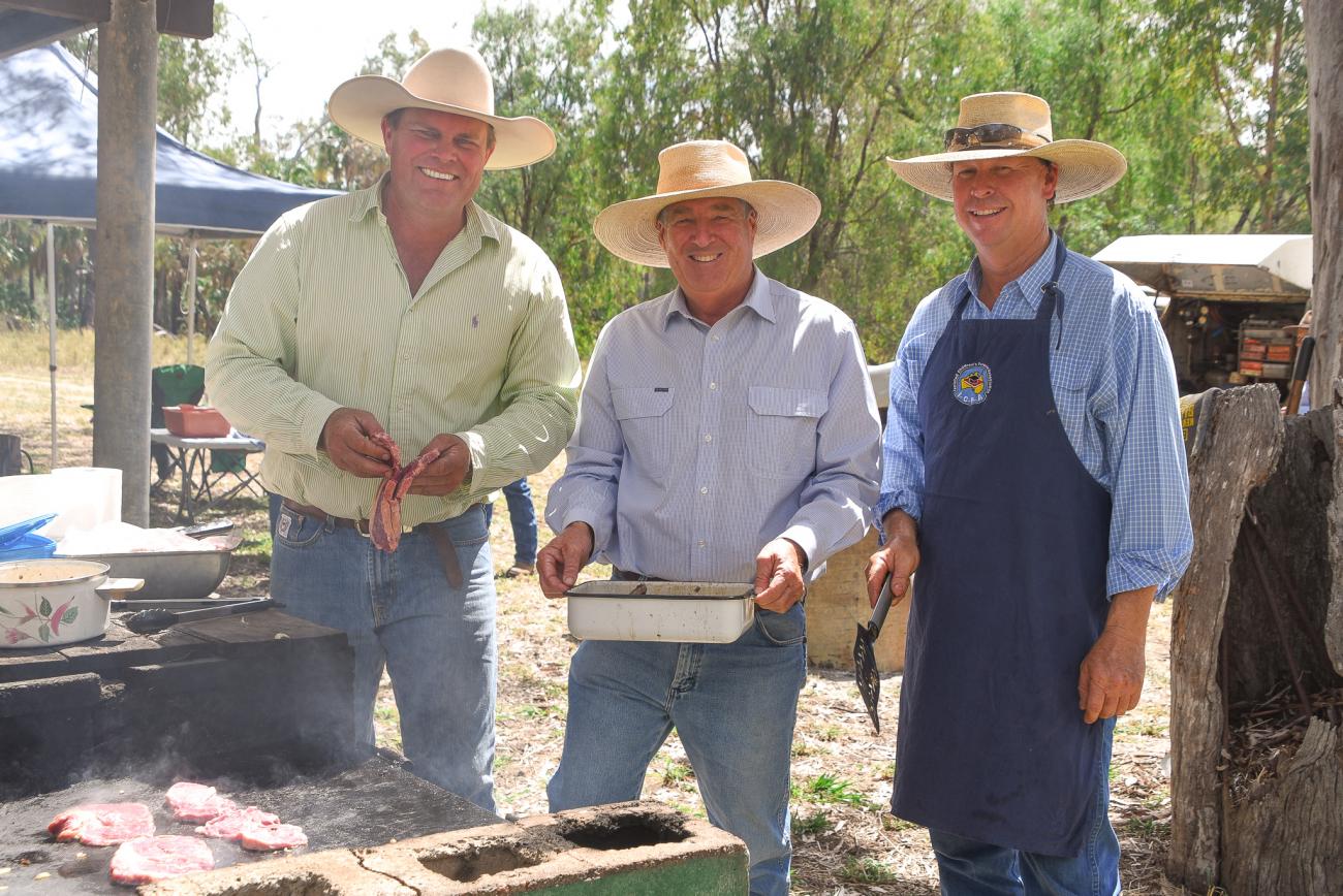 group of men barbecuing