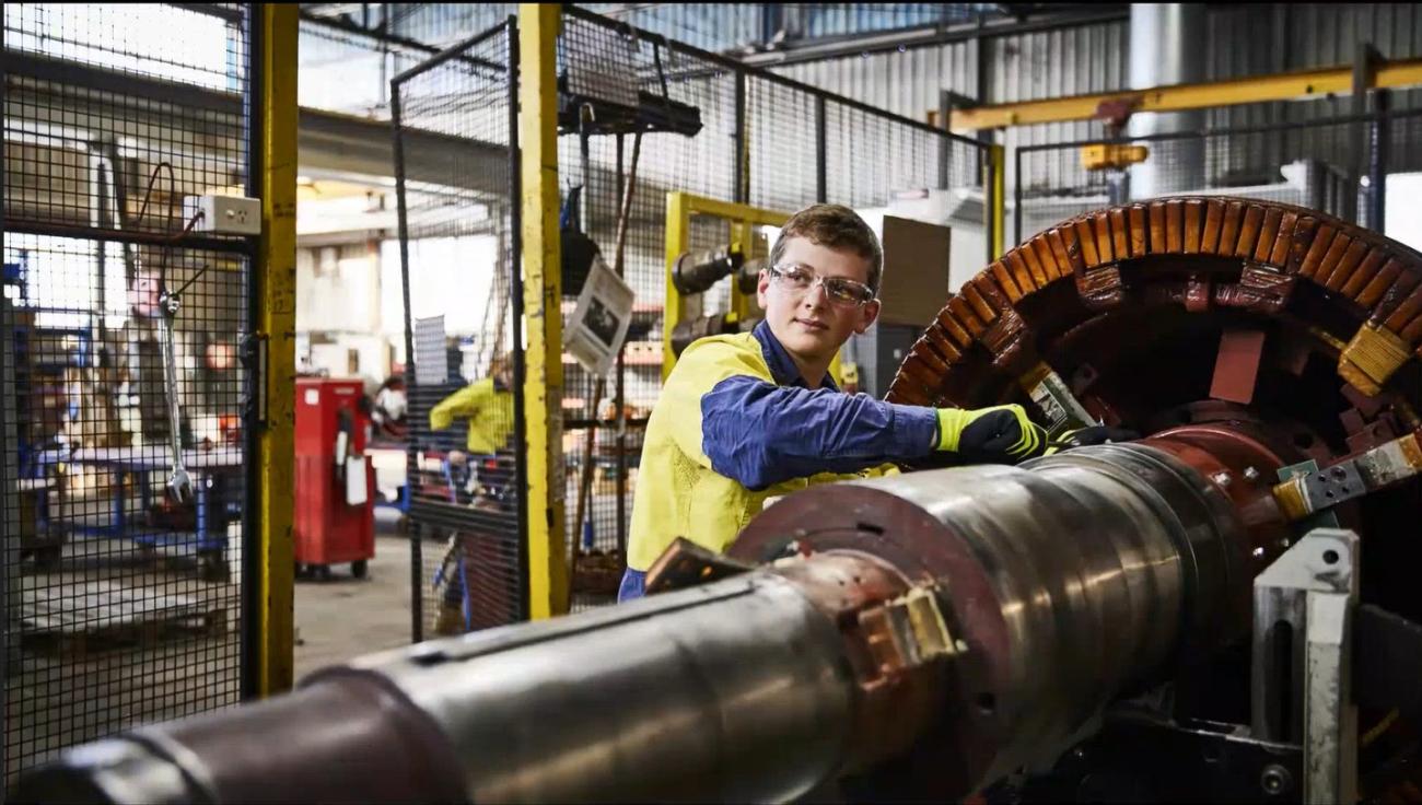 young boy in work clothes