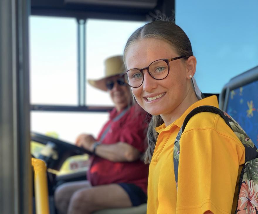 Child getting on school bus