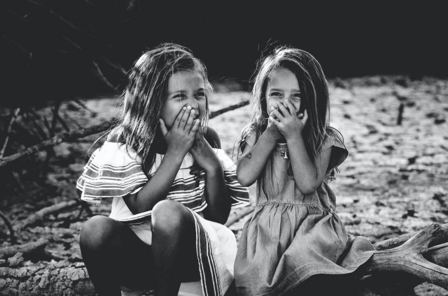 Two young girls giggling | Unsplash Image: caroline-hernandez-tJHU4mGSLz4