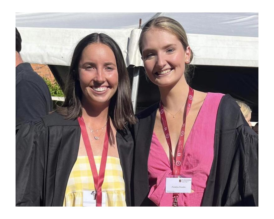 girls wearing graduation gowns