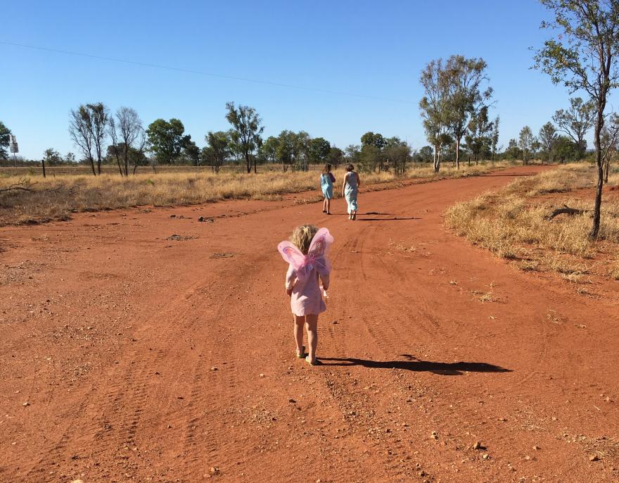 little girl running in the dirt