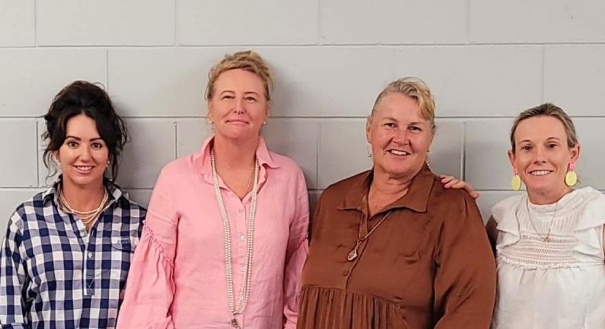 four ladies against wall