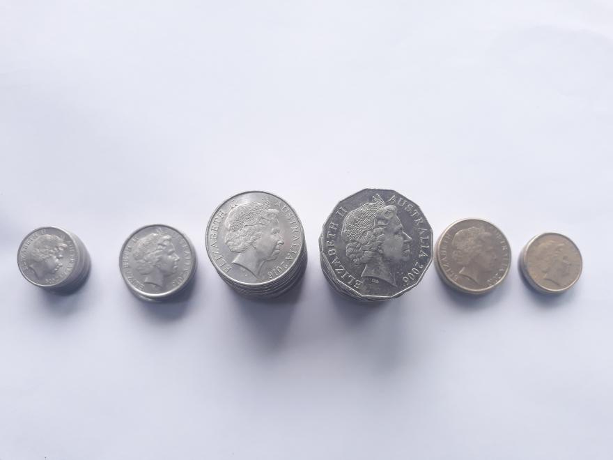 Australian silver coins lined up - Photo by Pawan Kawan on Unsplash