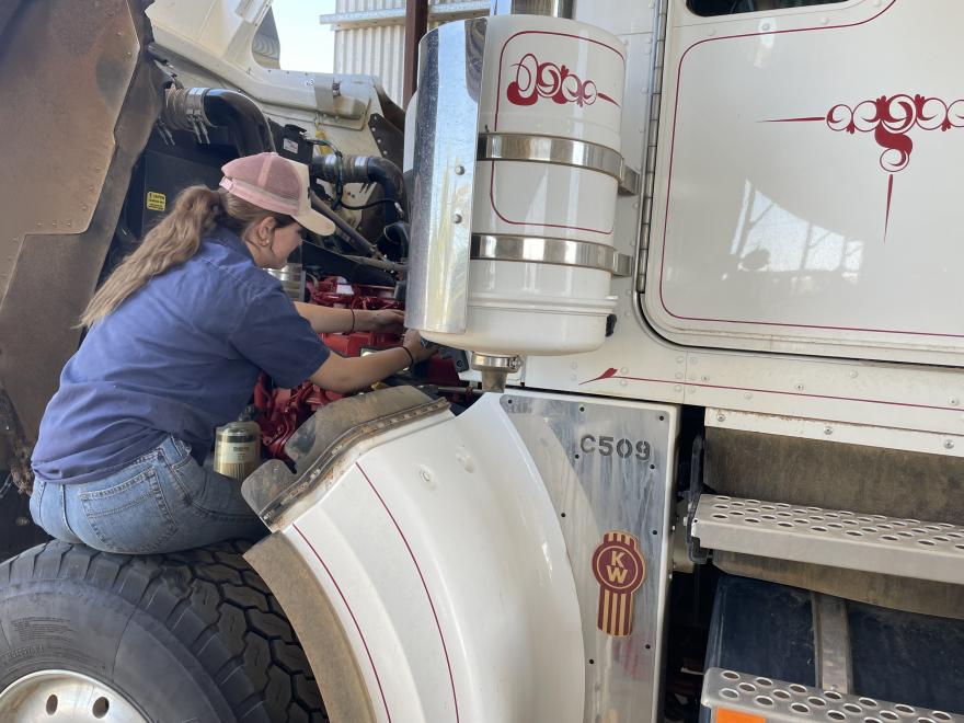 girl mechanic with truck