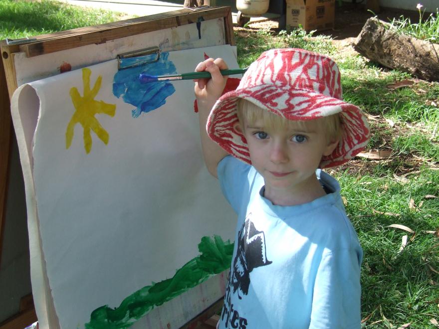 A picture of a boy painting.