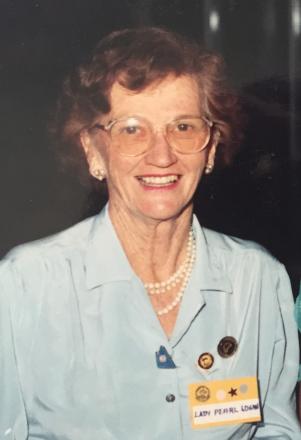 Pearl wearing a light coloured blouse