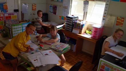 an image of 4 children in a home classroom