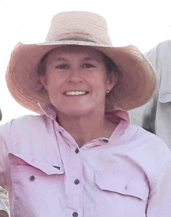 lady wearing pink shirt and hat