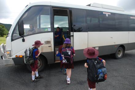 a picture of a school bus and children getting on