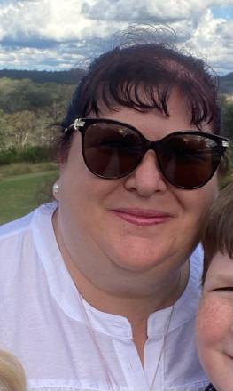 kimberley wearing white shirt and sunglasses