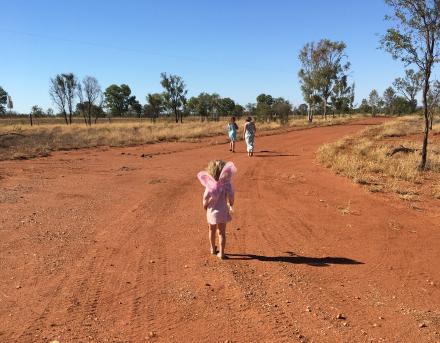 little girl running in the dirt