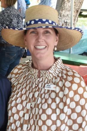 picture of Nikki Mahoney wearing tan and white dotted shirt and straw hat