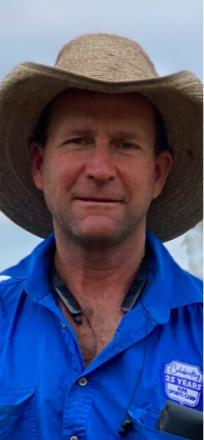 A picture of Rob McArthur wearning a blue shirt and a big wide brim hat.