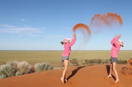 Girls on a sand dune