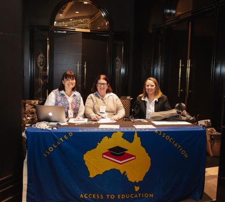 Three ladies at table