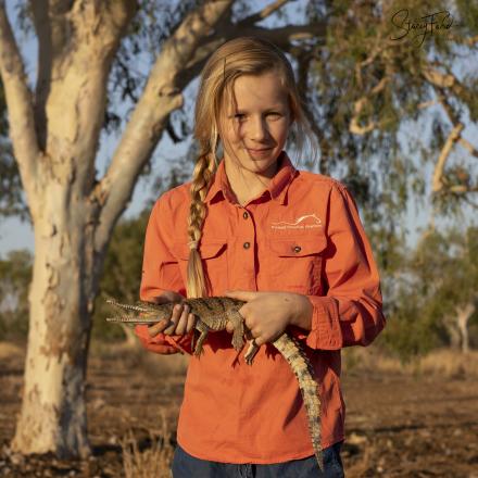 Young girl holding Australian Freshwater Crocodile