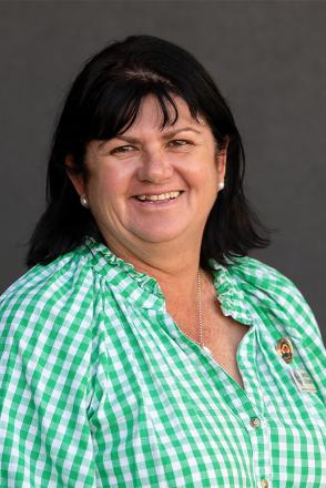 loretta wearing green and white gingham shirt