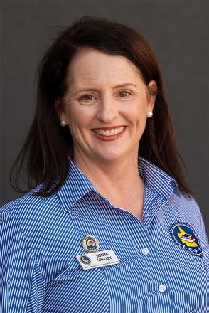 sonya wearing navy and white striped icpa shirt